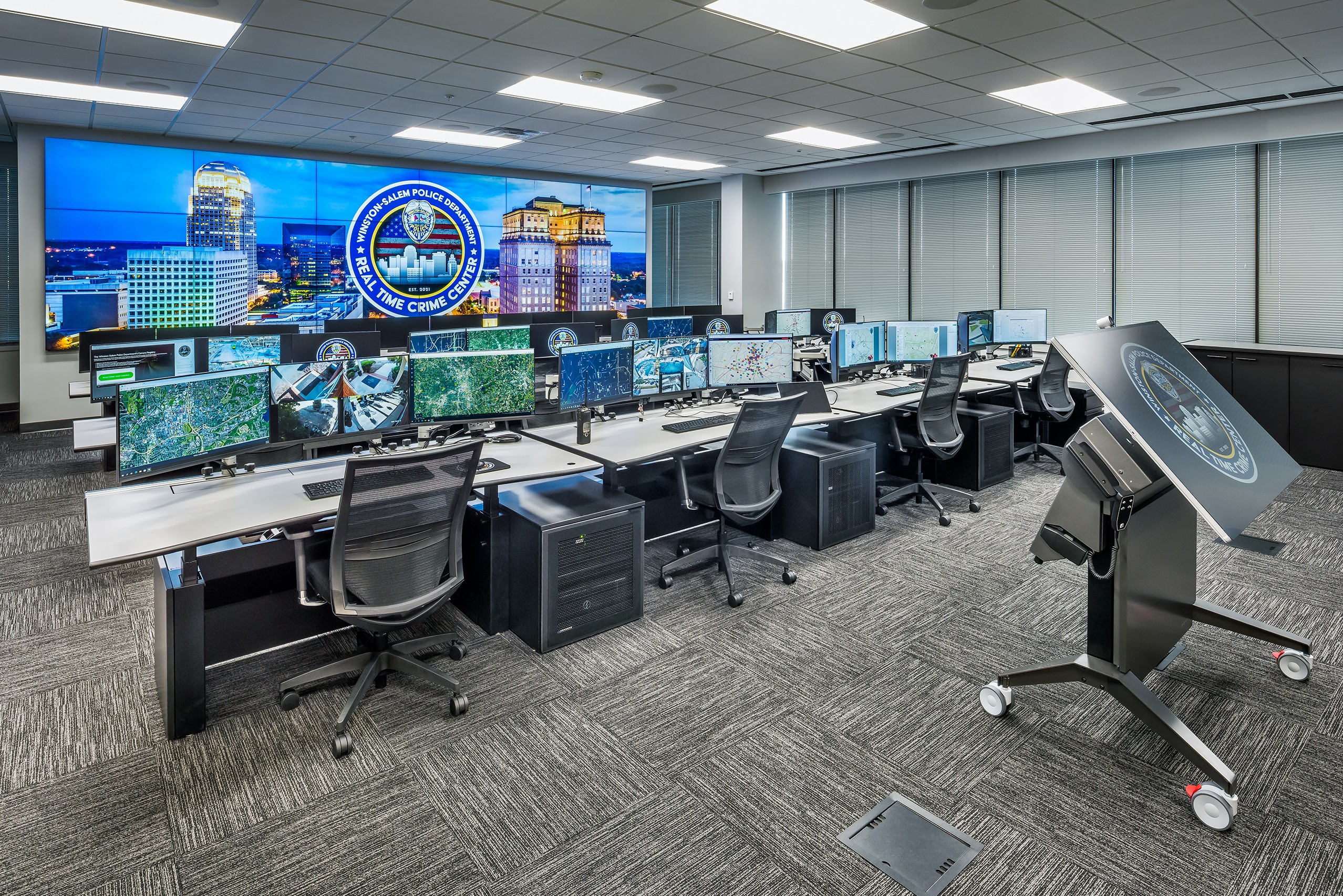 a room with a large screen that says ohio state police