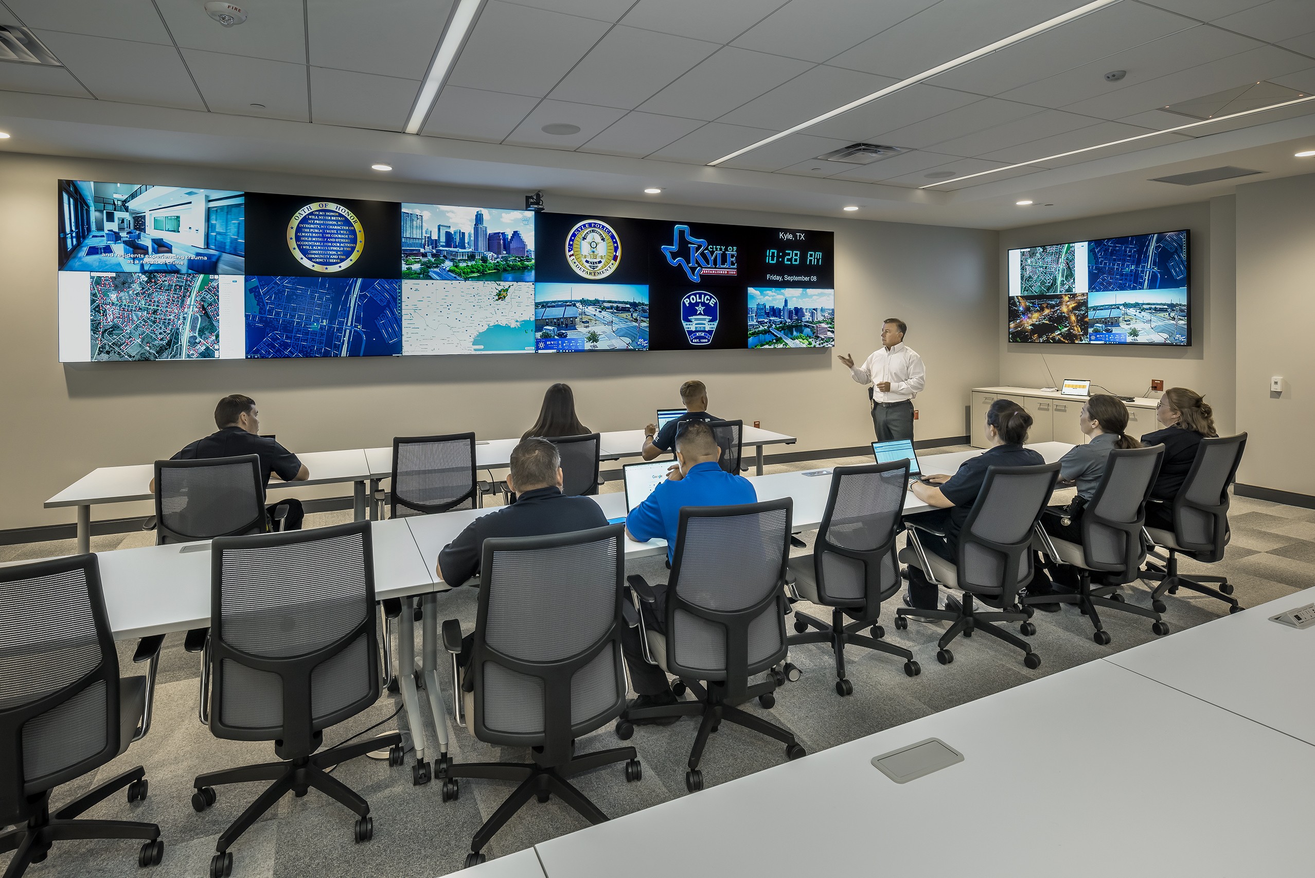 a man is giving a presentation to a group of people in a conference room