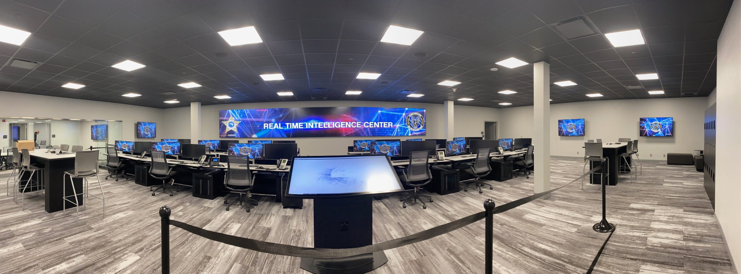 real-time crime center with video wall and consoles