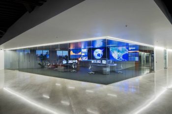 Video wall enclosed in a glass room